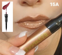 a woman is holding a lipstick and a lip liner