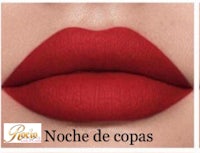a red lipstick with the words noche de copas