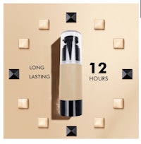 a bottle of concealer with a bottle of foundation on it