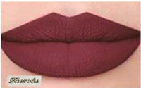 a close up of a woman's lips with a burgundy lipstick