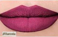 a woman's lips with a purple lipstick on them