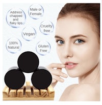 a woman is posing in front of three black cosmetics