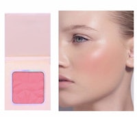 a woman's face with a pink blush powder