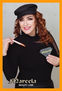 a woman in a black hat is holding a pencil