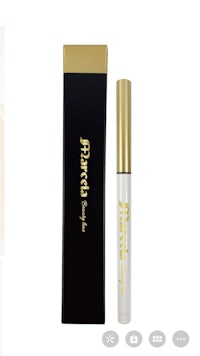 a white tube of mascara with a gold box
