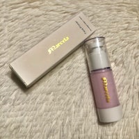 a bottle with a box on top of it