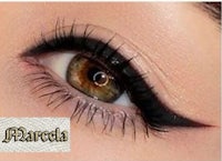 a close up of a woman's eye with black eyeliner