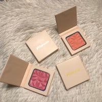 three blushes in a box on a furry surface